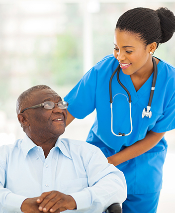 Nurse assisting an elderly man, symbolizing care and final expense insurance.